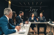© Artem - The business people sitting at the table