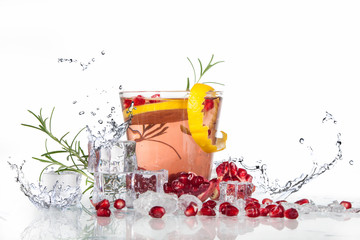 Wall Mural - summer pomegranate drink with lemon and mint with splashed water and ice