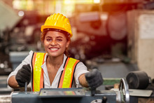 Girl Teen Worker With Safety Helmet Happy Smiling Working Labor In Industry Factory With Steel Machine.