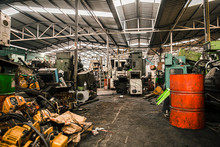Old Grunge Used Machinery Workshop Garage Or Heavy Machine Junkyard Warehouse Danger Workplace.