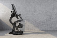 Old Retro Microscope Illuminated By Ray Of Light