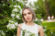 © artmim - Cute young teen woman outdoor. Healthy girl in flowers garden