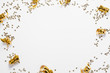 Golden circular confetti frame top view