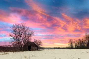 Wall Mural - a isolated lonely shack sits in a field lit by the moonlight overhead. rural farmland near tyendinag