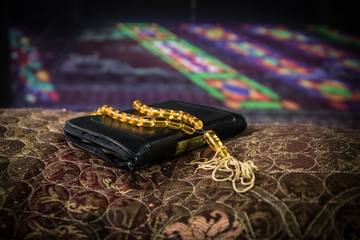 Wall Mural - Koran book of muslim people. Holy muslim koran on eastern carpet in mosque.