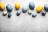 Fototapeta Desenie - Naturally dyed colorful Easter eggs on grey concrete background