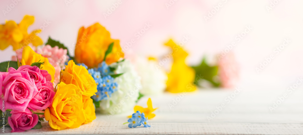  Beautiful spring flowers on white wooden table. Festive concept with copy space. - obrazy, fototapety, plakaty 