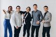 © anatoliycherkas - Cheerful multiracial professional business people laughing together standing in row near wall, happy diverse young employees students group, corporate staff team having fun, human resource concept