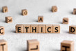 Ethics - words from wooden blocks with letters, ethics moral philosophy concept, white background