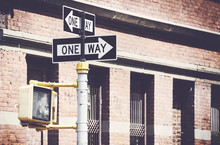 Retro Stylized Picture Of One Way Street Signs In New York.