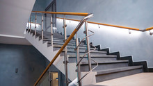 Stainless Steel, Glass And Wood Railing.Fall Protection. Modern Design Of Handrail And Staircase	