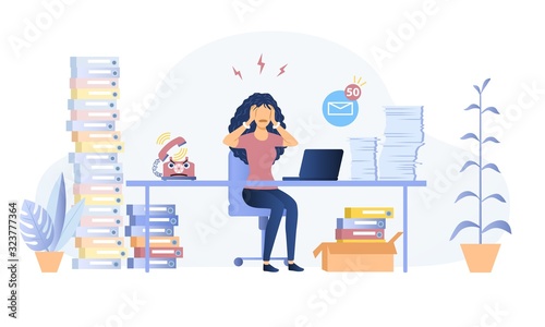 Fotografía Stressed overworked woman in an office seated at her desk surrounded by heaps of