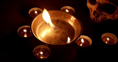 Wall Mural - Burning pentacle on altar closeup footage