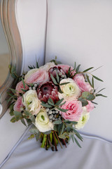 Wall Mural - Wedding flowers, bridal bouquet closeup. Decoration made of roses, peonies and decorative plants, close-up, selective focus, nobody, objects