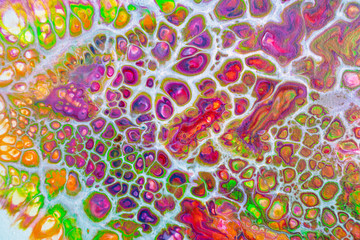 Acrylic paint pouring on canvas with lots of cells and creative colors. Texture, design, pattern, wallpaper, background and art concept.