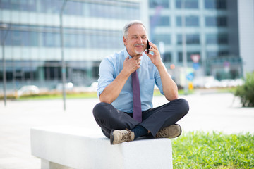 Canvas Print - Senior businessman talking on the phone