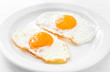 Plate with tasty fried eggs on table, closeup