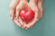 © SewcreamStudio - Adult and child hands holding Red heart , heart health, donation, happy volunteer charity, CSR social responsibility,world heart day, world health day,world mental health day,foster home