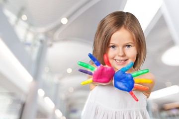 Wall Mural - Cute little girl with colorful painted hands