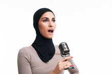 Muslim Woman Singing With Microphone Over White Background