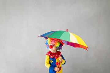 Wall Mural - Funny kid clown playing indoor