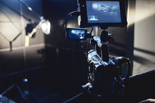 Video Production Backstage. Behind The Scenes Of Creating Video Content, A Professional Team Of Cameramen With A Director Filming Commercial Ads. Video Content Creation, Video Creation Industry. Low