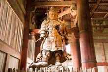 Photograph Of A Large Wooden Statue Of A Protective God