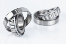 Close-up Tapered Roller Bearings Spare Part Of Mechanical On The White Background..