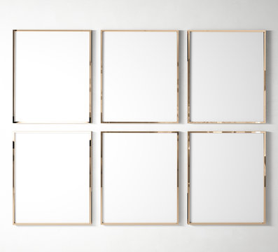 set of 6 Gallery Rose Gold Poster Frames hanging on white wall background in bright interior mock up, 3D rendering, illustration 