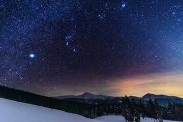 Wall Mural - a bright starry night in the mountains with the milky way in the sky, venus and millions of stars hi