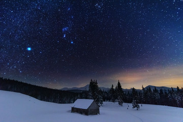Wall Mural - a bright starry night in the mountains with the milky way in the sky, venus and millions of stars hi