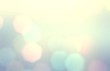 © avextra - Bokeh pastel abstract pattern. Bright lights blurred texture. Yellow blue gradient background.