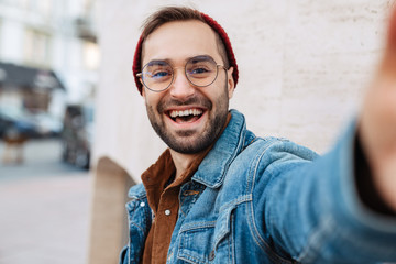 Sticker - Close up of a handsome young stylish bearded man