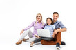 © Angelov - family with laptop over white background