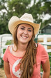 © MACO - Smiling portrait of young cowgirl. Bridger, Montana, USA