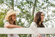 © MACO - Two western girls leaning on fence. Bridger, Montana, USA