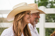 © MACO - Profile of smiling cowgirl and her father. Bridger, Montana, USA