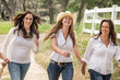 © MACO - Three western women walking along white fence. Bridger, Montana, USA