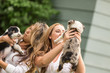 © MACO - Two young girls holding puppies. Bridger, Montana, USA