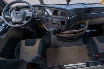 Interior part of a truck. A whole cabin including seat, wheel, pedals.... 