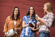 © MACO - Two western girls and mother laughing, next to barn, holding chickens. Bridger, Montana, USA