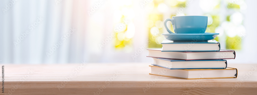 stack book and cup of coffee on wooden table - obrazy, fototapety, plakaty 