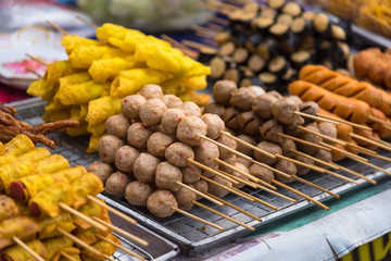 Wall Mural - Meatballs with bamboo, wood stick. Traditional Street Food Thailand.