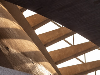 Poster - Abstract image of sun light shining through modern architecture concrete stairs