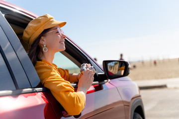 Smiling woman with a retro camera