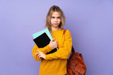 Fototapeta  - Teenager Russian student girl isolated on purple background feeling upset