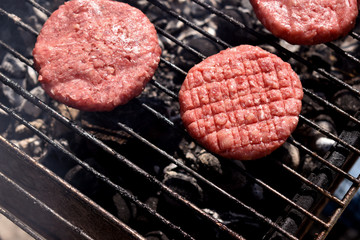 cooking burgers in nature on fire