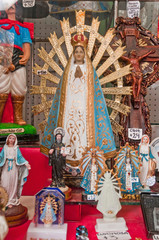 Wall Mural - Argentina's Lujan virgin statues for sale.