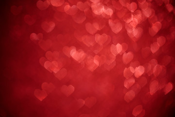 Wall Mural - Shiny red hearts bokeh light background. Valentine day, wedding or mother day concept