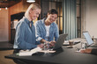 © Flamingo Images - Smiling businesswomen working together on a laptop in an office